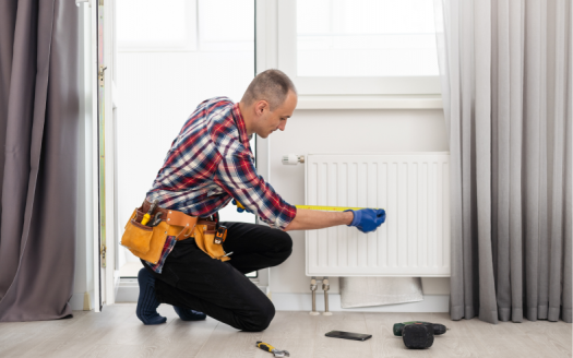 Man repairing heating panel