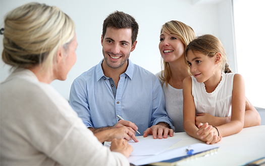 real estate agent discussing with homeowners
